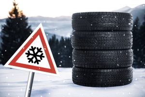Set,Of,Winter,Tires,And,Road,Sign,Outdoors